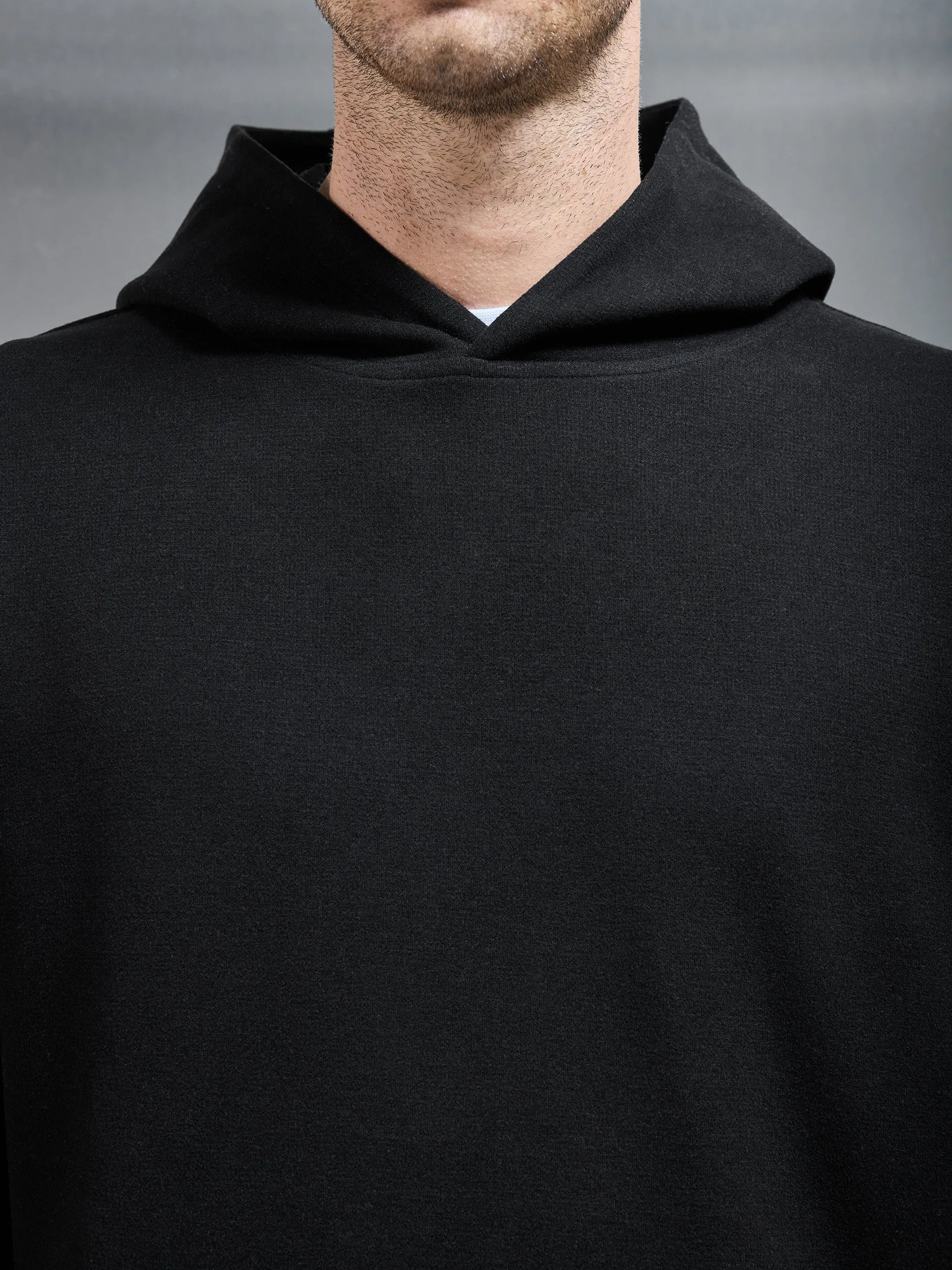 Relaxed Fit Knitted Hoodie in Black