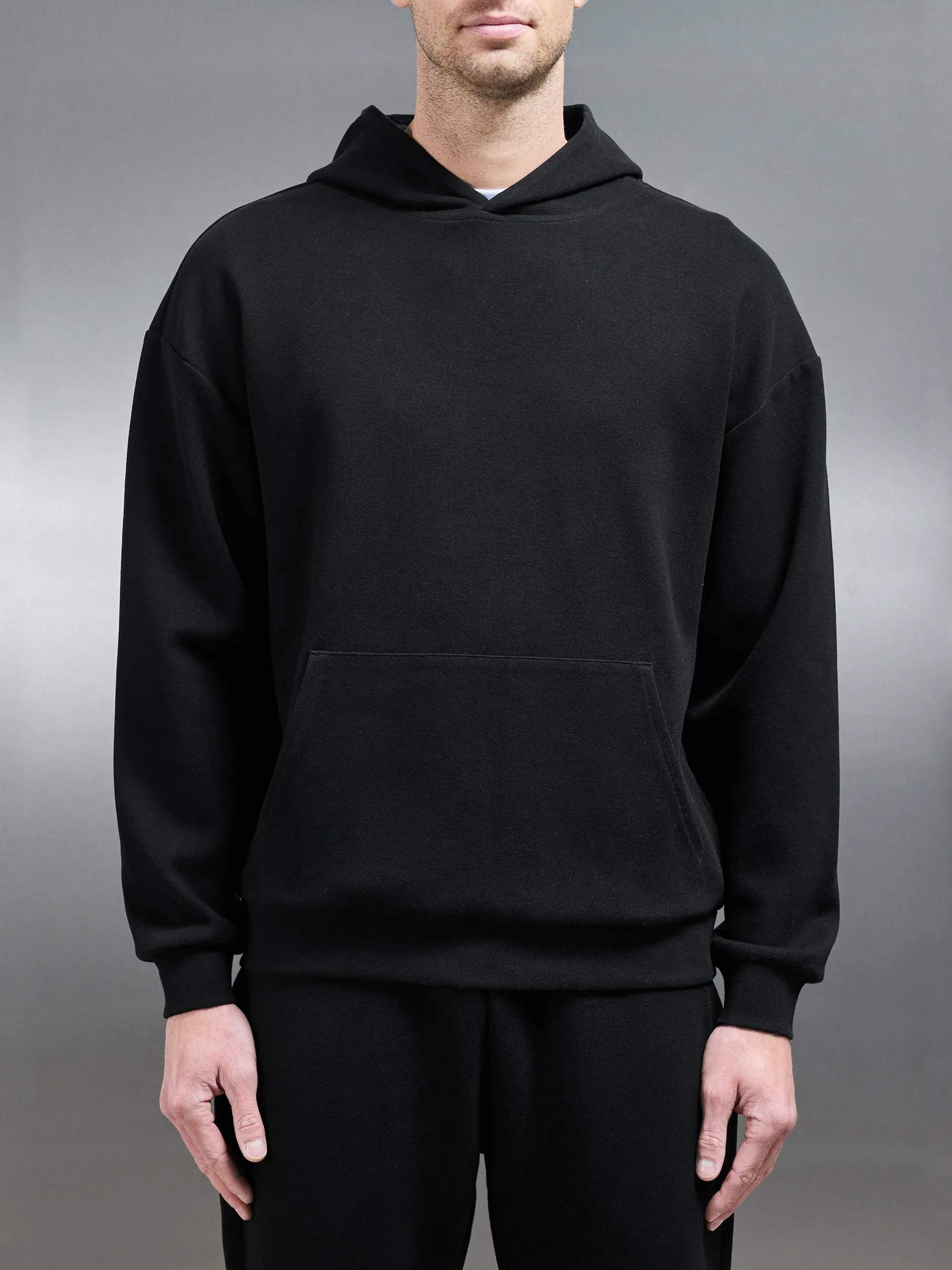 Relaxed Fit Knitted Hoodie in Black